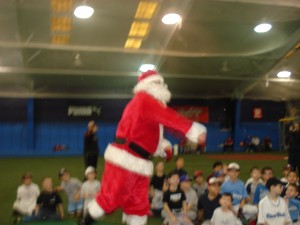 Santa throws out the 1st pitch of the holiday season